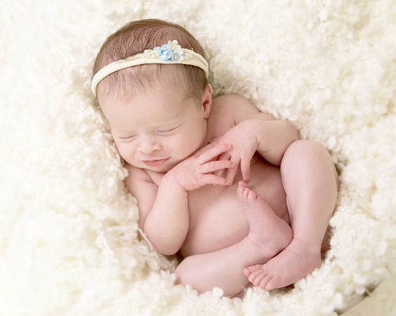 Newborn baby girl in basket
