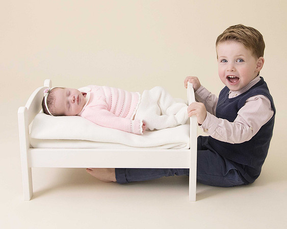 Newborn baby girl in bed