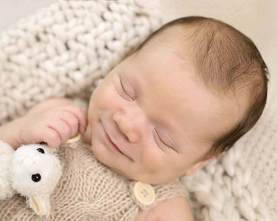 Newborn baby boy in posie