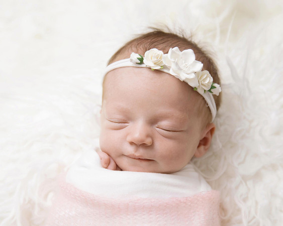 Newborn baby girl in pink